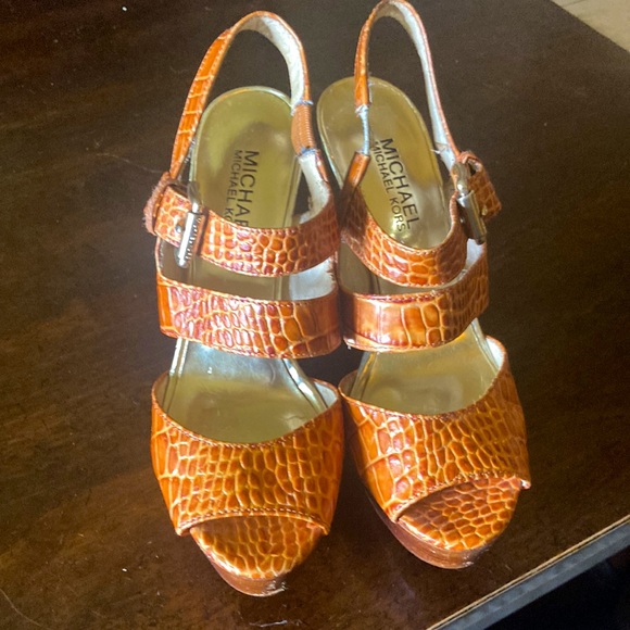 Michael Kors. Size 6. Orange platform heels. Gold buckle and decals. - Picture 2 of 7